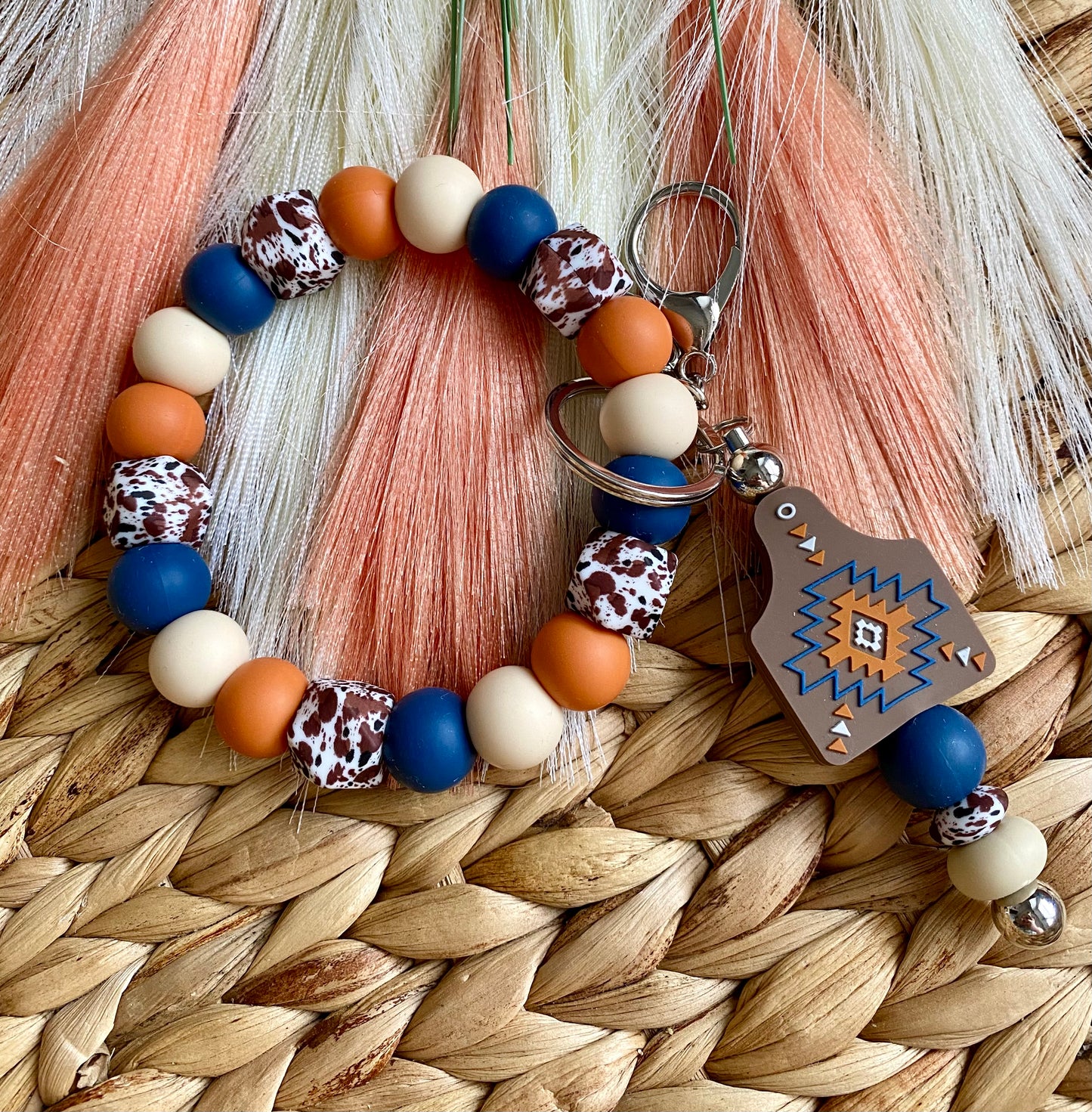 Burnt Orange Cow Tag - Wristlet